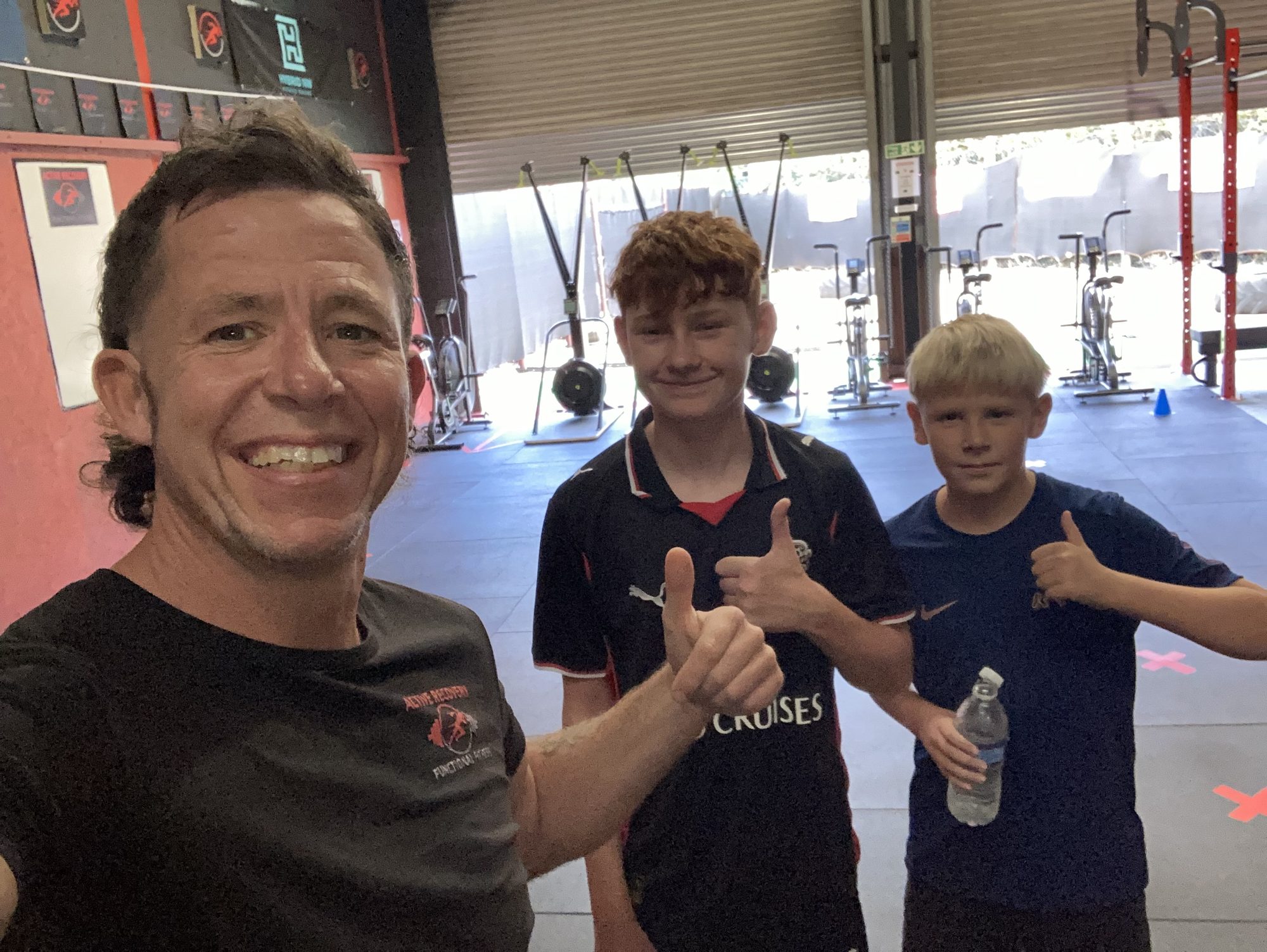 Ben with two young athletes
