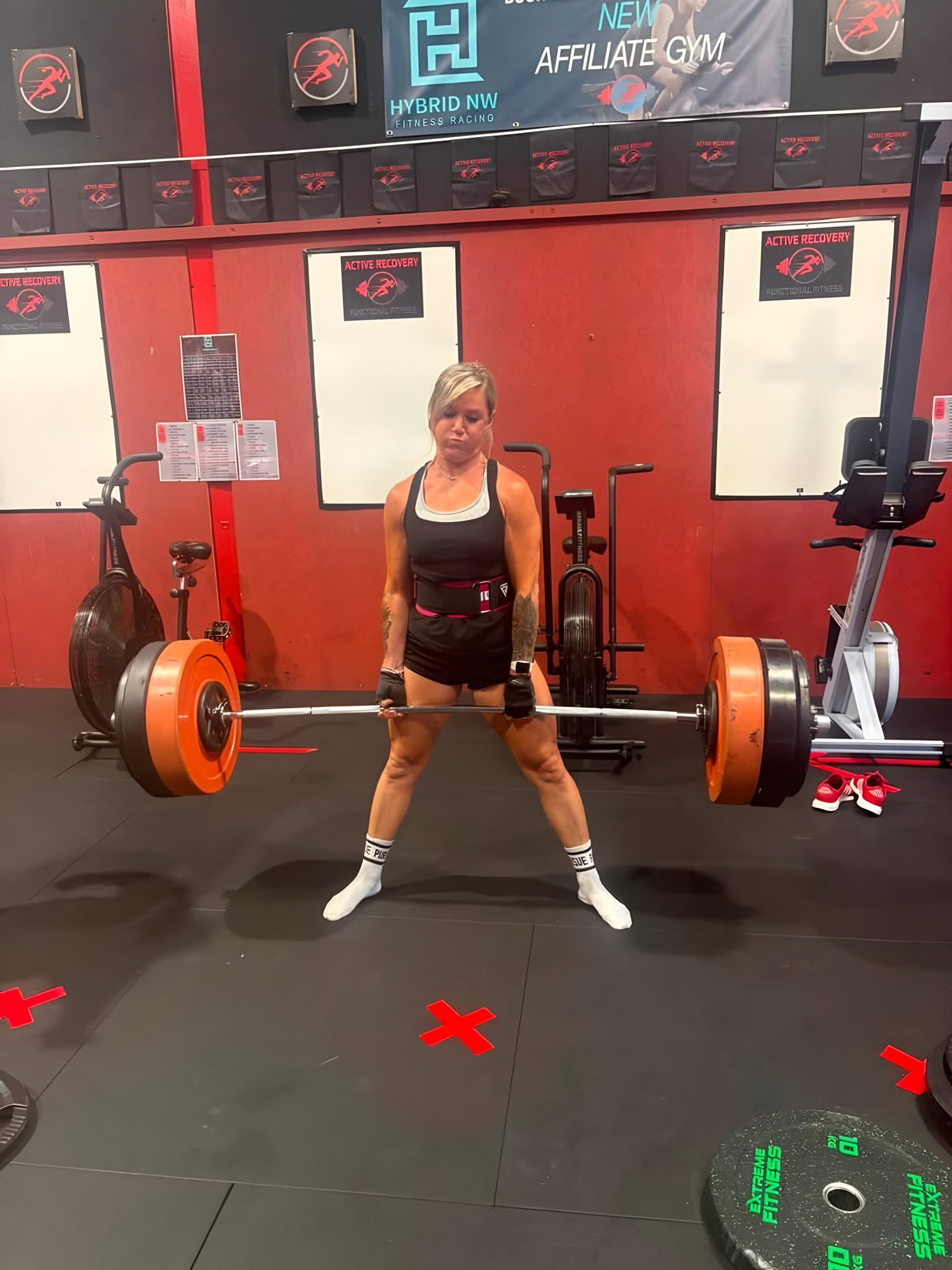 Member lifting a barbell