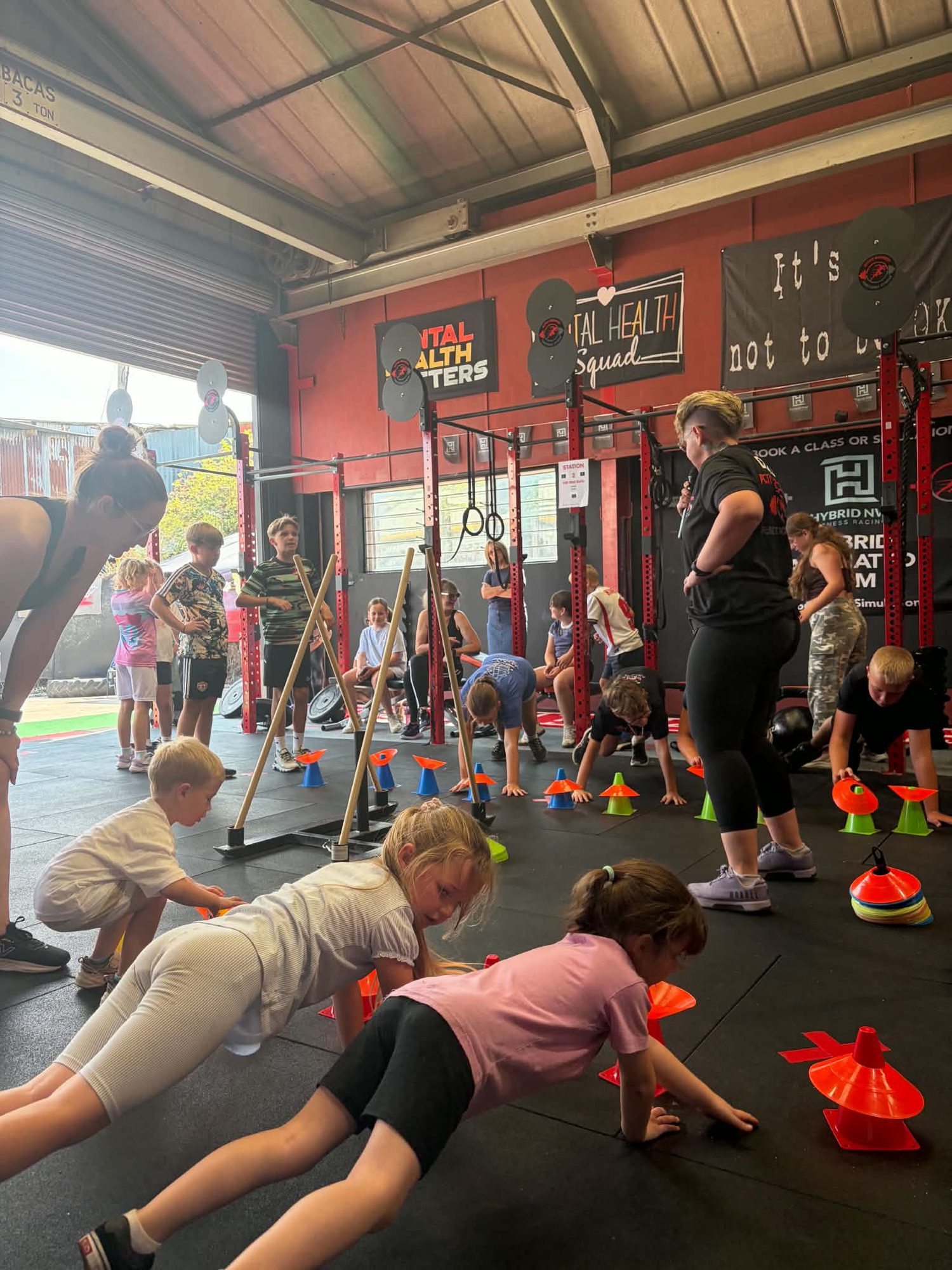 Children doing press-ups in a class