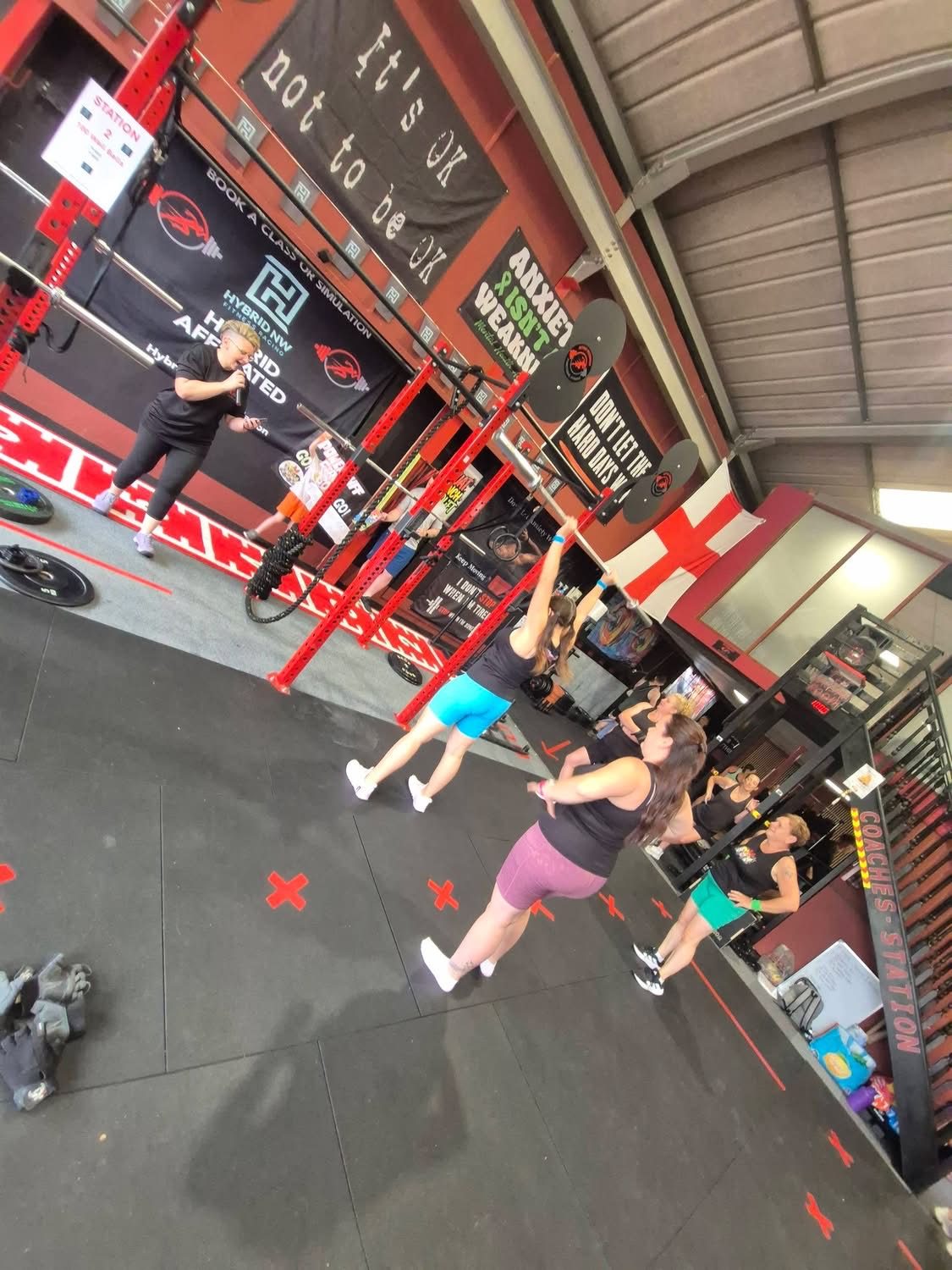 Members throwing medicine balls at the wall